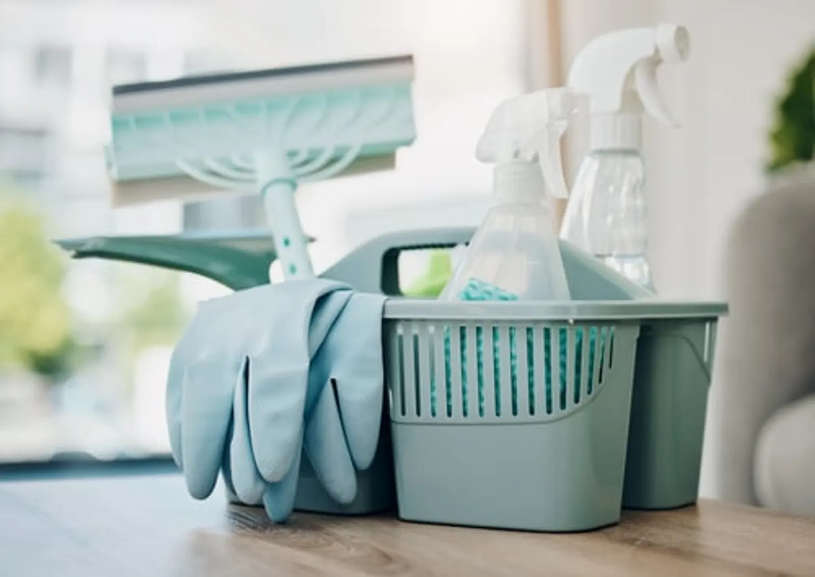 Cleaning supplies and gloves set out in a bright Florida home